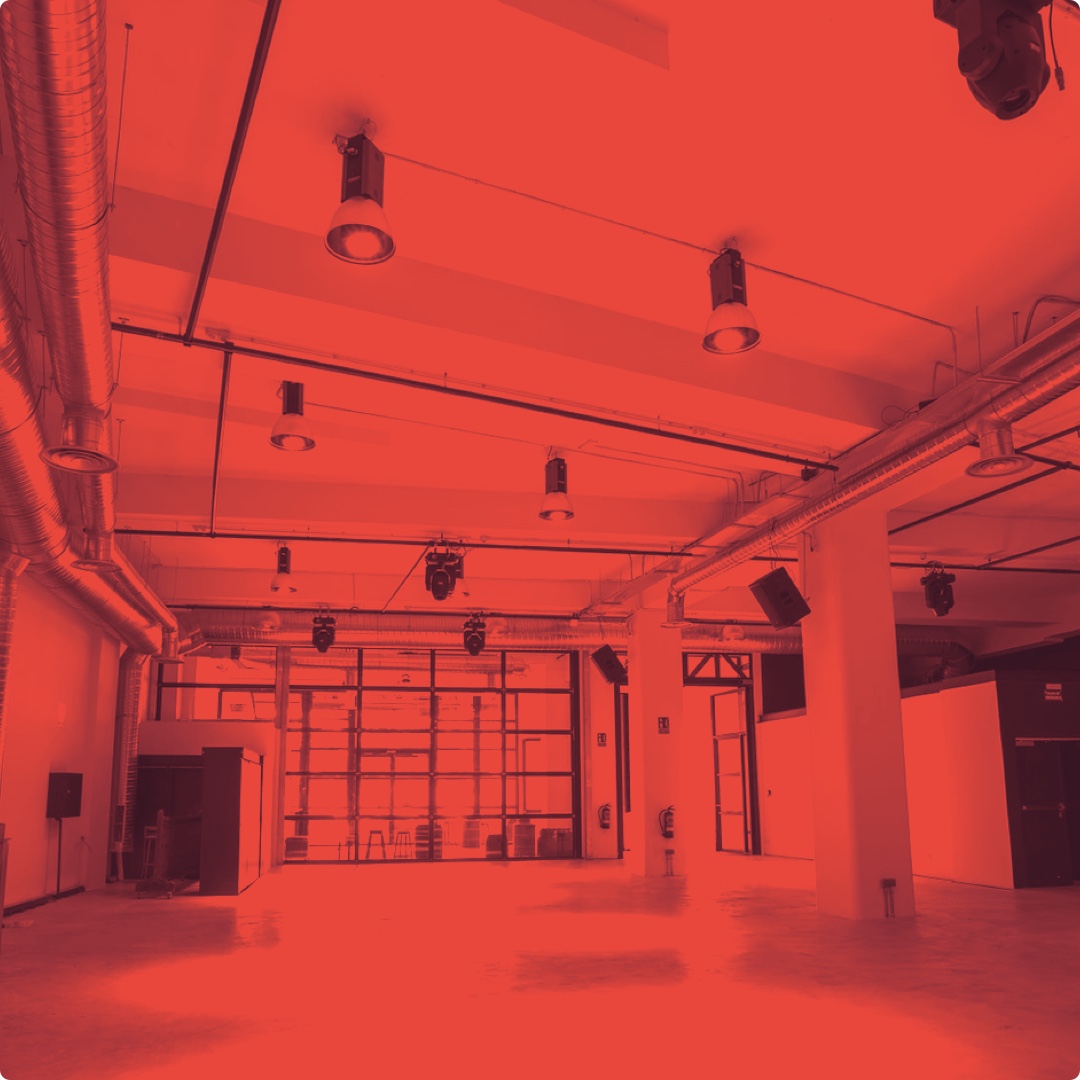 photo of the conference venue: empty hall with glass windows/doors on one side